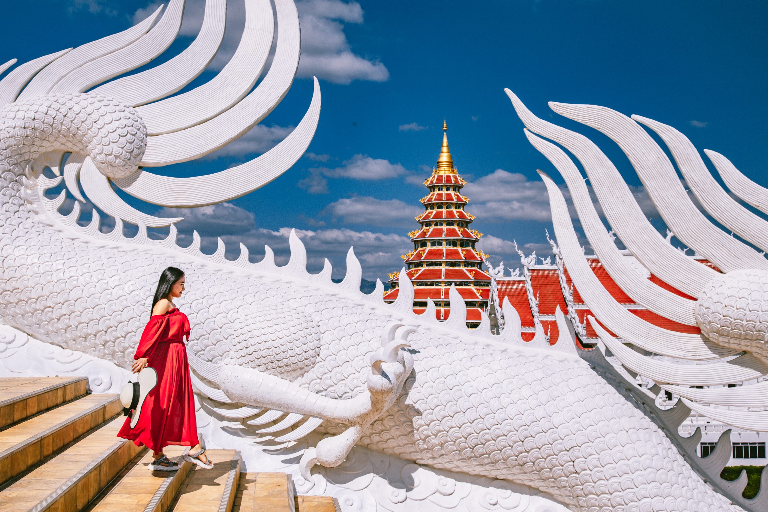 Wat Huay Pla Kang, white big buddha and dragons in Chiang Rai, Chiang Mai province, Thailand. High quality photo